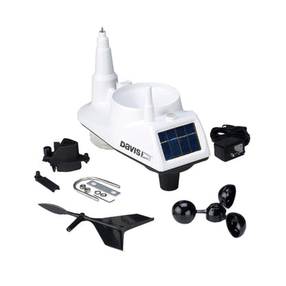 White Davis weather sensor body with solar panel laid out beside a detached cup anemometer, wind vane, mounting hardware and power cable