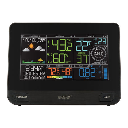 La Crosse colour display console showing forecast temperature wind rain and humidity readings