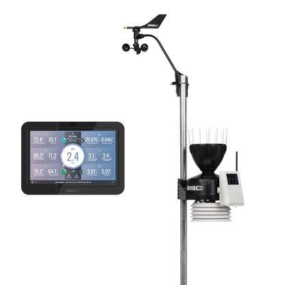 Davis weather station on a pole with wind vane, cup anemometer, rain collector, solar-panel sensor unit and colour display console